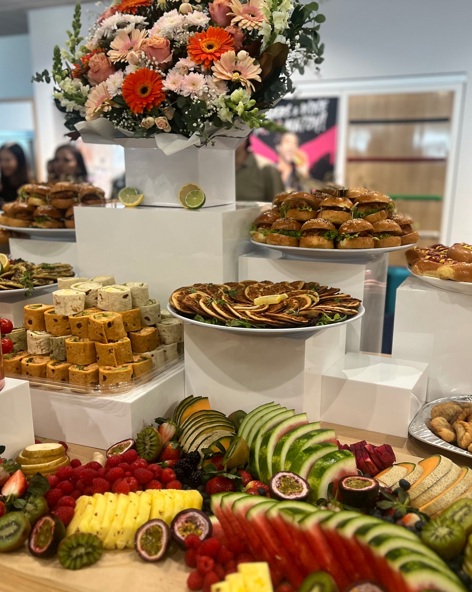 Sliders, wraps and fruit mountain with flowers