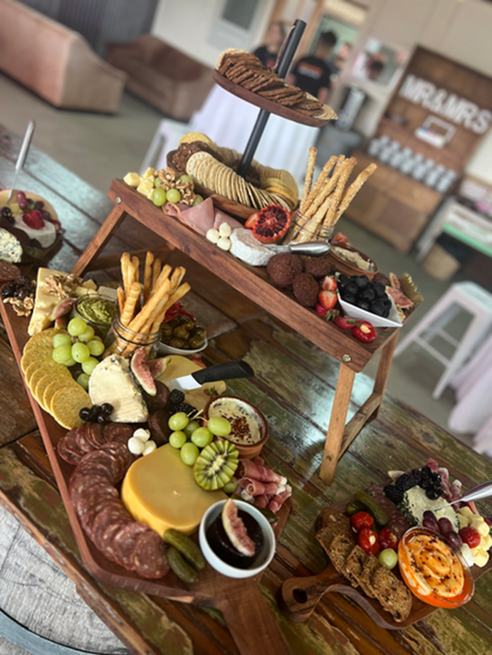 Elevated charcuterie and fruit grazing board spread